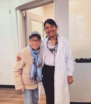 dr. vijaya kallam with a adult patient in Frsico