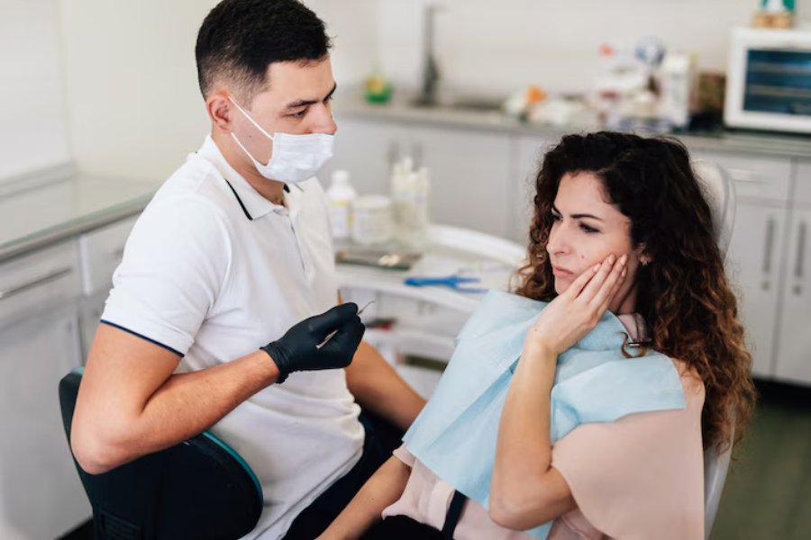 emergency dentist in Colleyville, TX speaking with patient